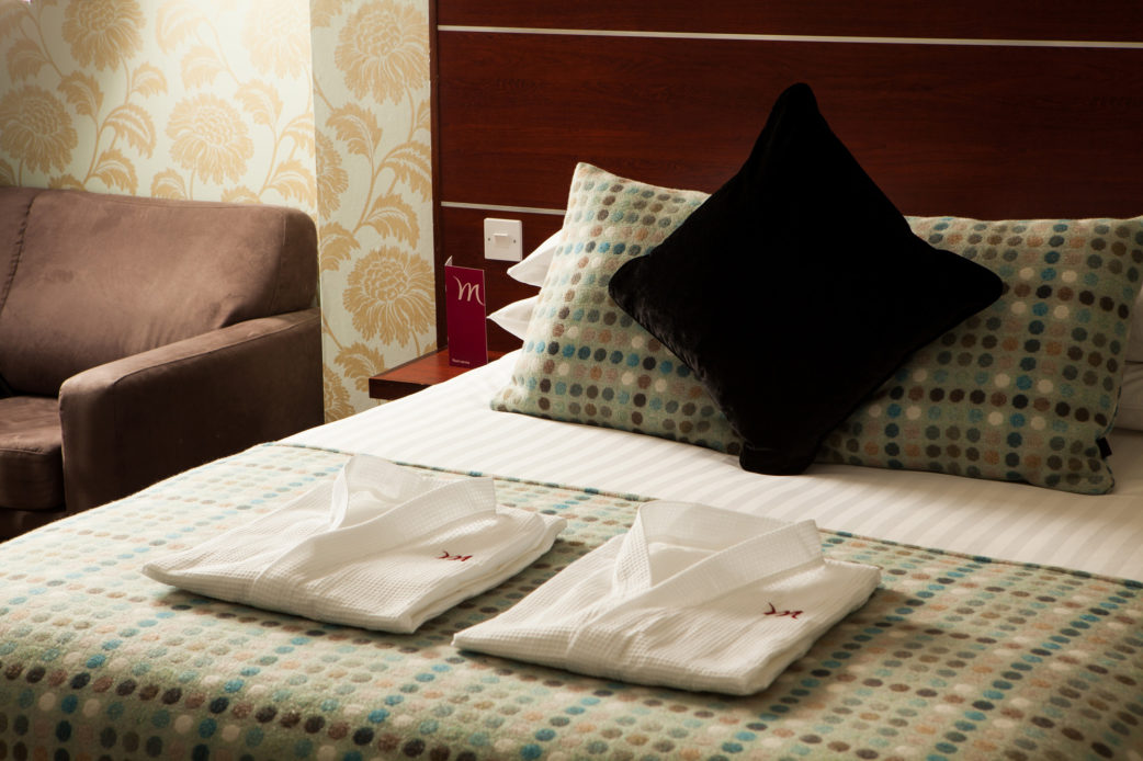 mercure-hotels-jh-bedroom-privilege-room_020l-120514 Double bed and headboard in a Privilege Room at Mercure Hotels