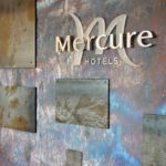 Mercure branding detail in the Foundry Restaurant & Bar at Mercure Sheffield Parkway Hotel, metal wall decoration