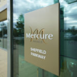 Plaque on glass door with Mercure logo