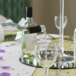 Pouring a glass of wine at wedding breakfast at Mercure Sheffield Parkway Hotel