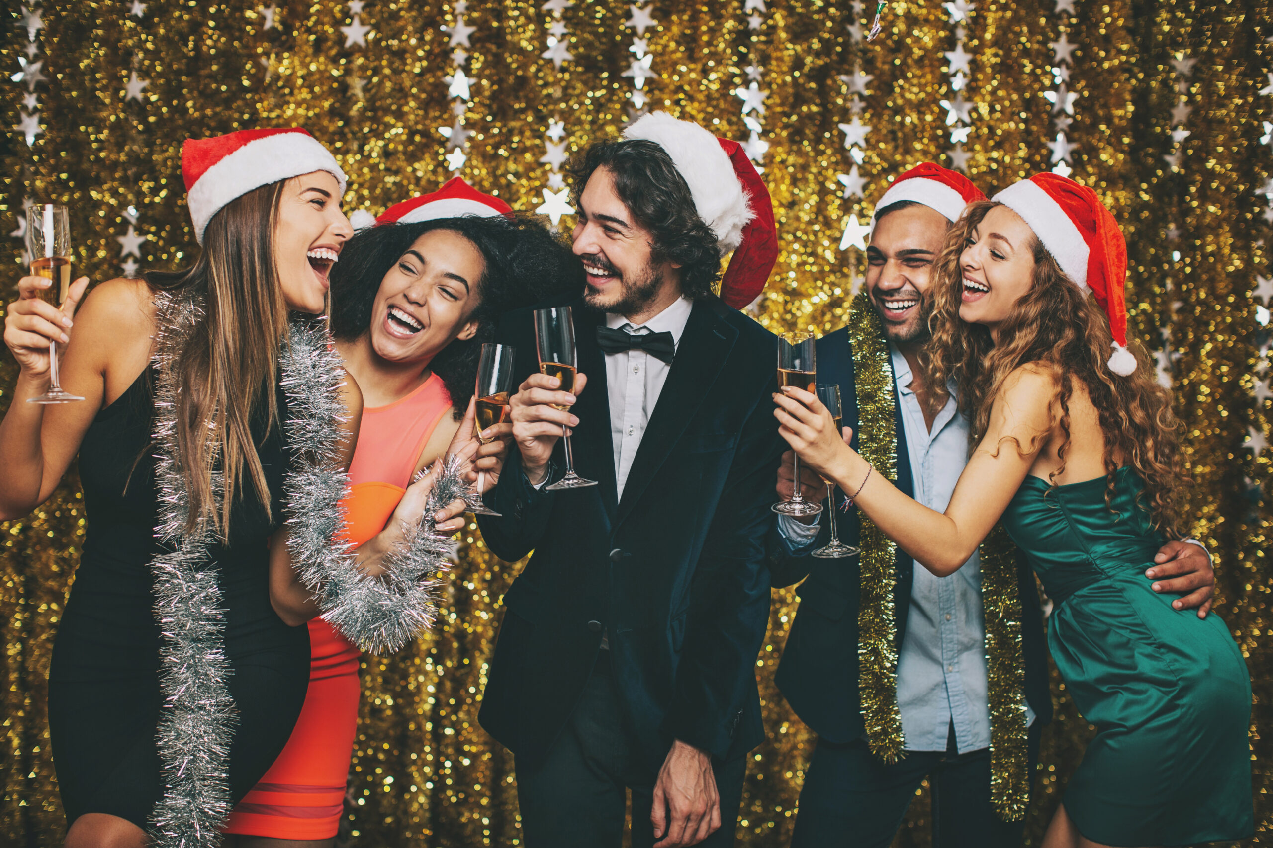 Multi-ethnic group celebrating Christmas and New Year Work colleges partying
